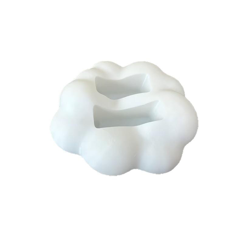 White cloud-shaped silicone remote control holder with a central rectangular cutout designed as a desktop organizer stand.