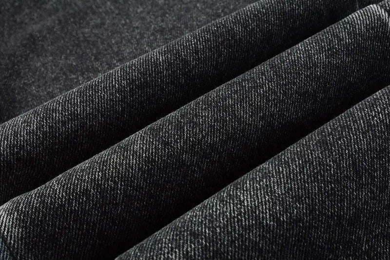 Men flare jeans distressed dark gray denim trousers featuring a textured woven pattern in dark gray denim fabric.