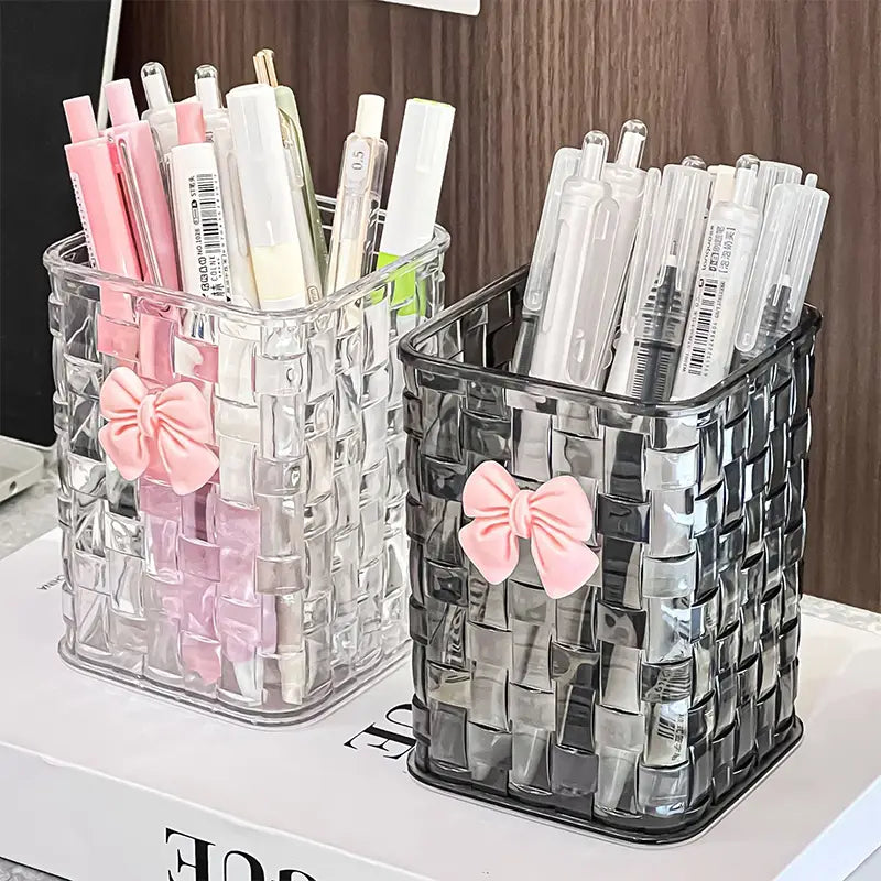 bow pen holder desktop storage organizer featuring clear and black woven plastic pen holders each adorned with a pink satin bow for elegant desk organization