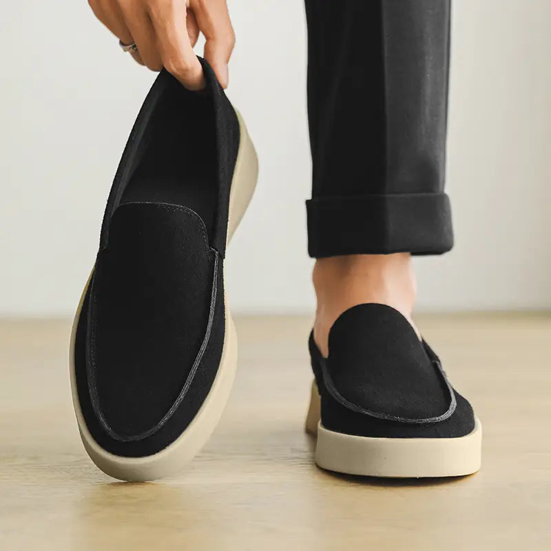 Black suede slip-on loafer with a cream-colored rubber sole designed as men casual suede loafers slip on walking shoes.