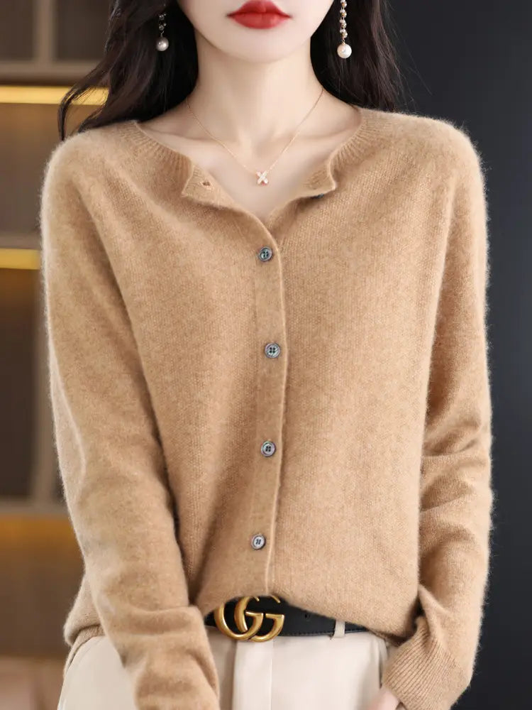 A soft camel-colored merino wool cardigan for women with a subtle textured knit, elegant silver-toned buttons, and a gently flared neckline.