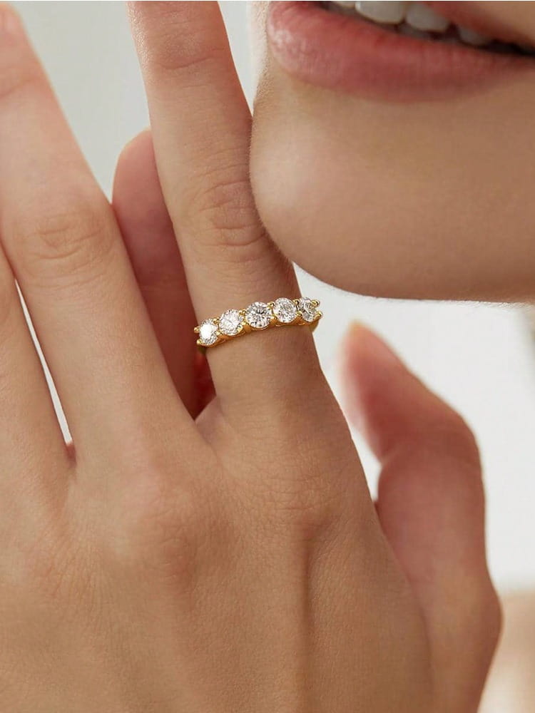 Sterling silver zircon ring for women featuring a delicate gold band with five round-cut diamonds in an elegant design.