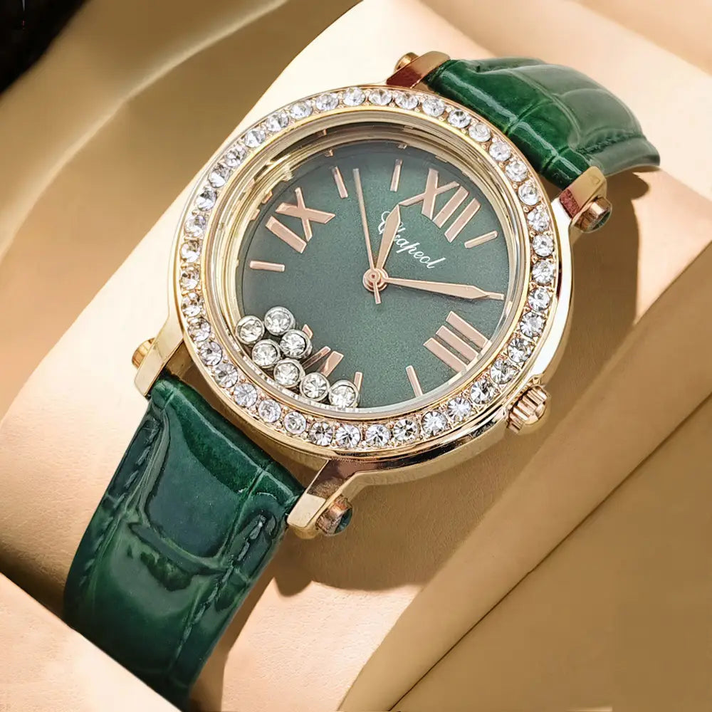 A luxurious green leather crystal women watch featuring a green crocodile leather strap, gold-tone case encrusted with clear crystals, and roman numeral hour markers.