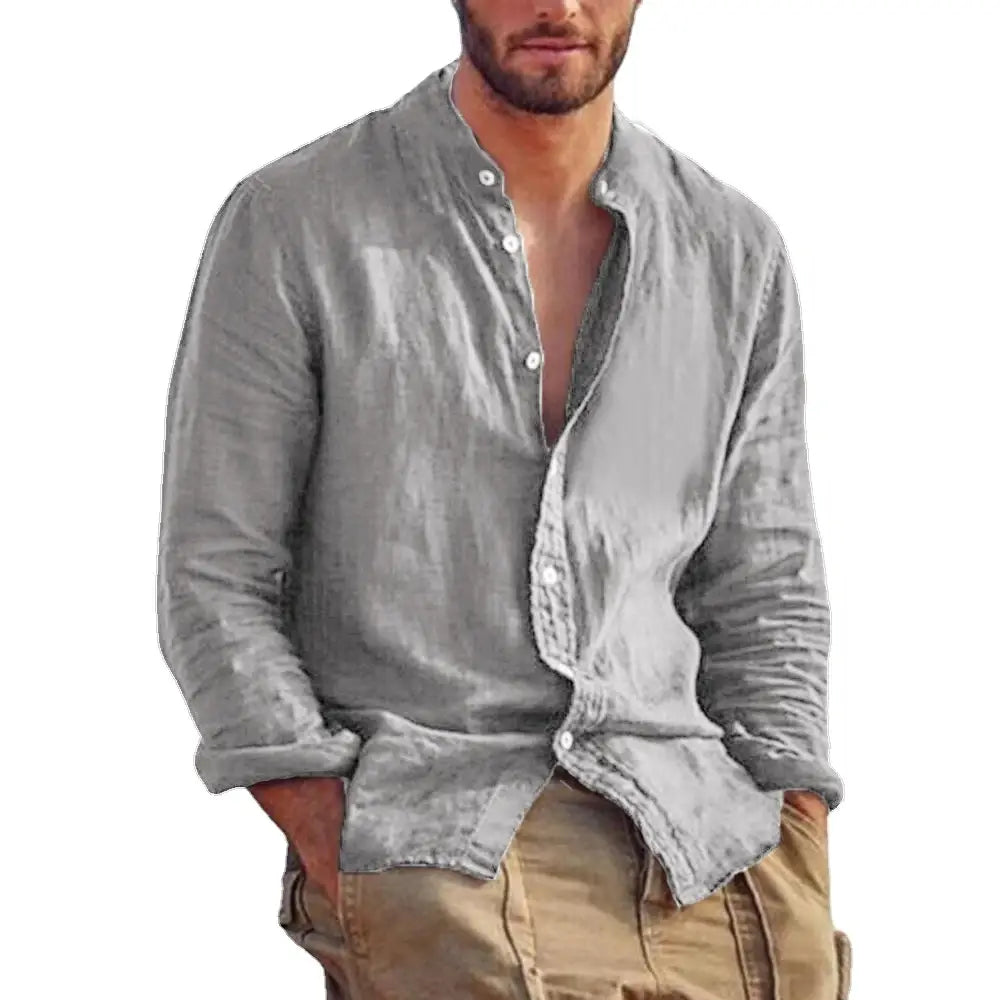 A light gray men’s linen long sleeve casual shirt with button-down front and rolled-up cuffs.