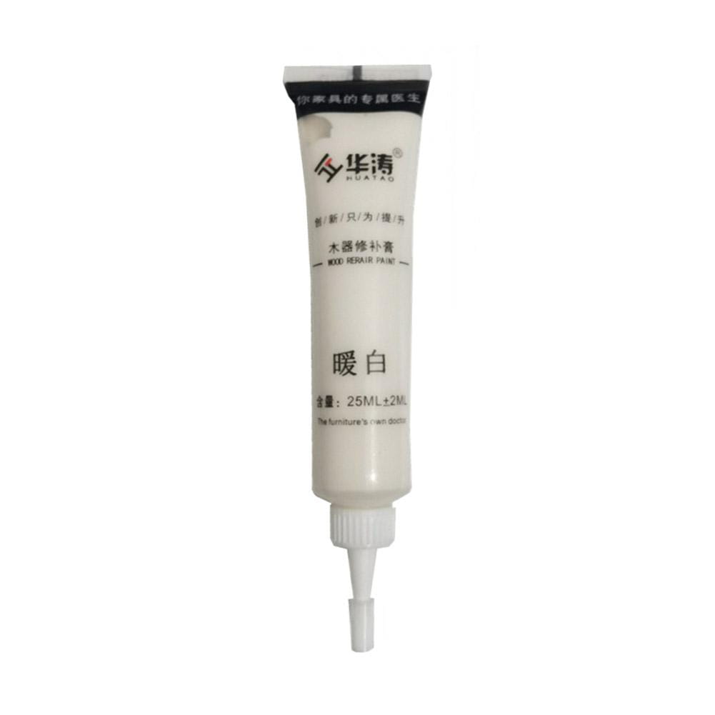 White tube of huatuo wood repair paste with a fine nozzle tip for scratch repair and touch-up paint applications.