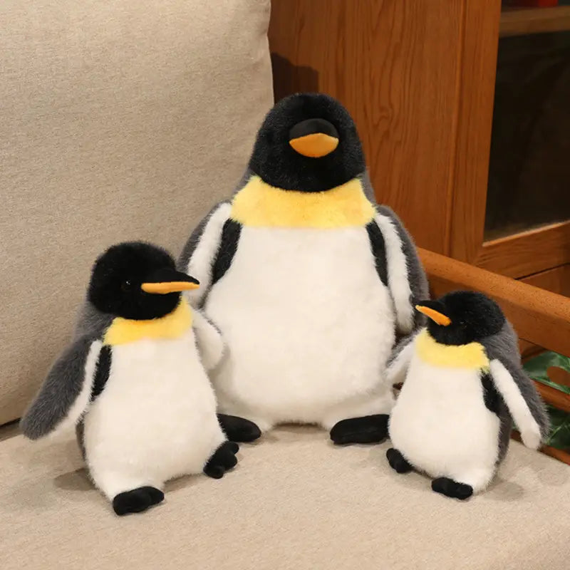 soft plush penguin stuffed animal set featuring a family pair with black white and yellow accents and orange beaks designed as a soft toy.
