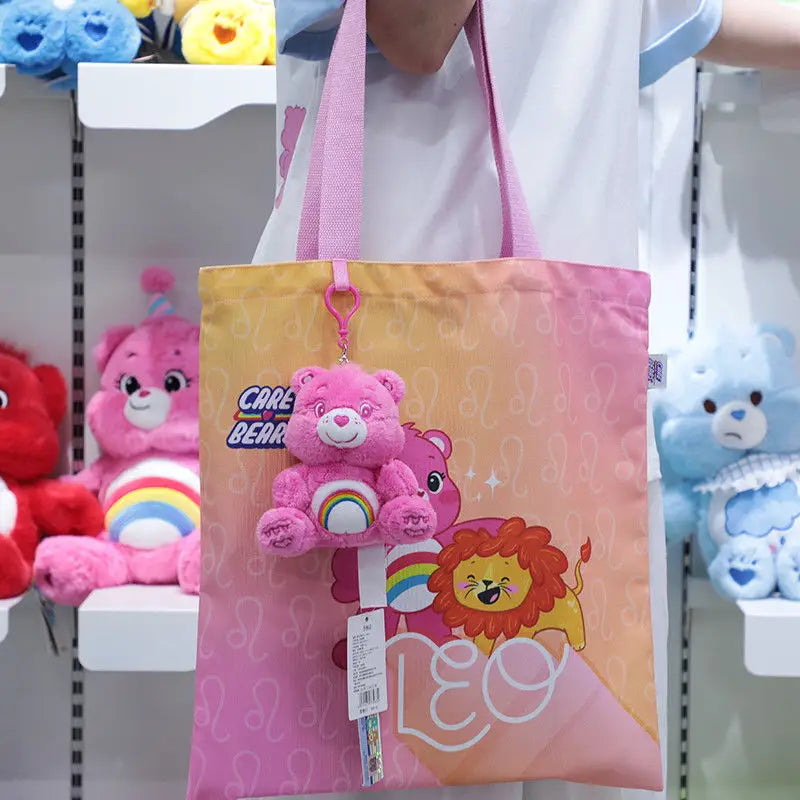 Pink care bears plush bag pendant keychain toy tote bag with a rainbow design and a plush bear charm.