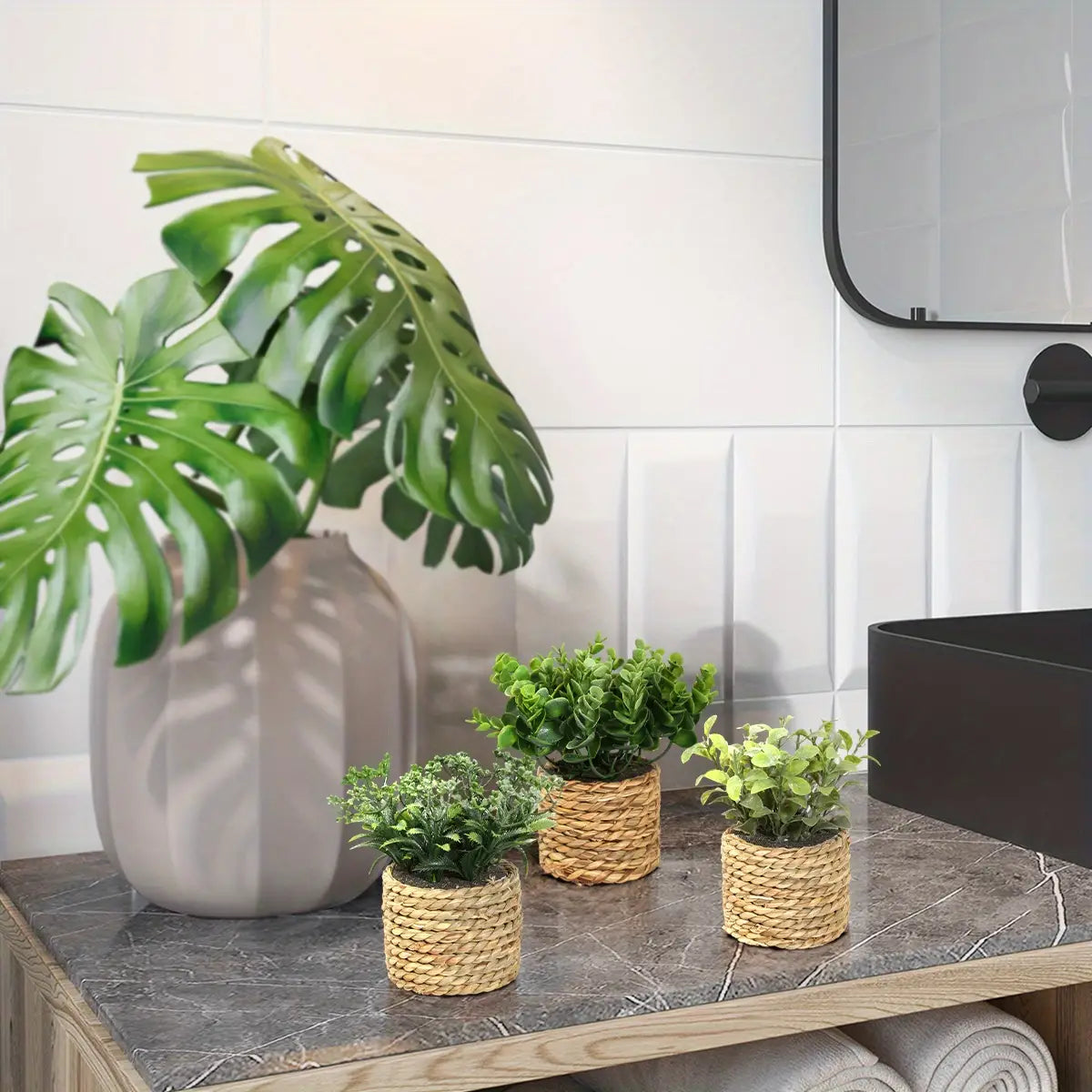 three small woven wicker planters each holding a different green artificial plant featuring eucalyptus flowers perfect for decorative small potted plants measuring 17cm