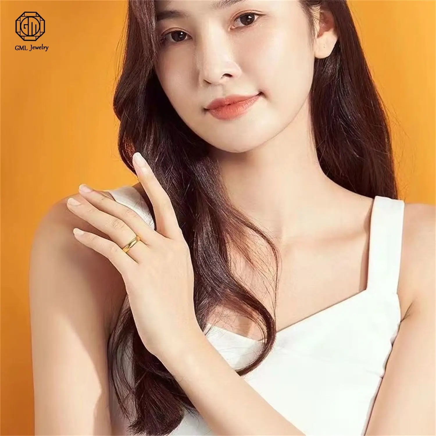 gold adjustable ring in sand gold with a matte wide band and fade resistant finish worn on the model’s finger with a sleek minimalist design