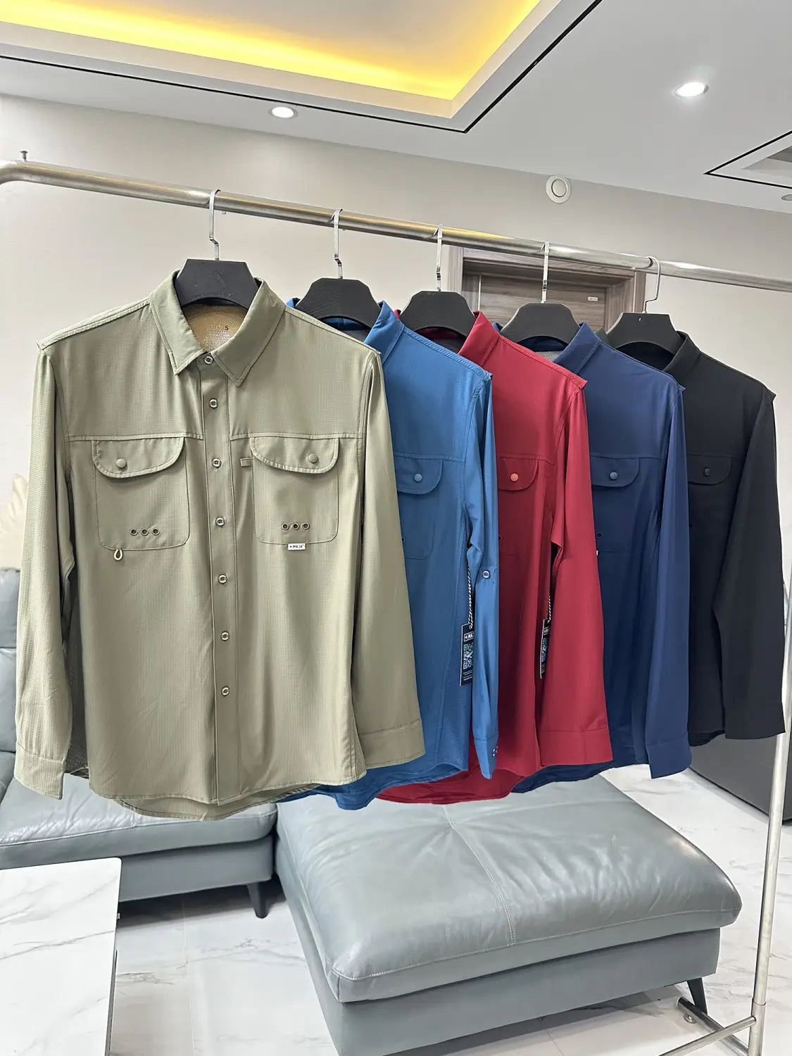 Men’s tactical outdoor long sleeve beige shirt made of durable fabric with two chest pockets and a subtle brand tag.