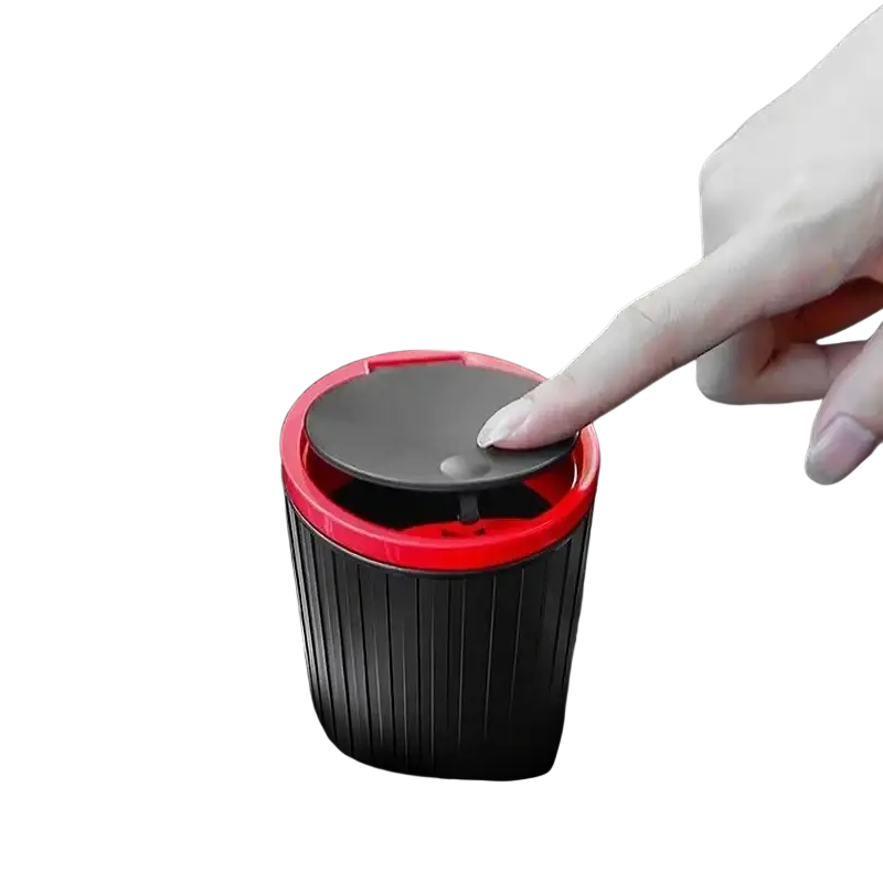 Red and black press-to-open car trash bin with ribbed cylindrical body storage bucket for car trash accessories feature