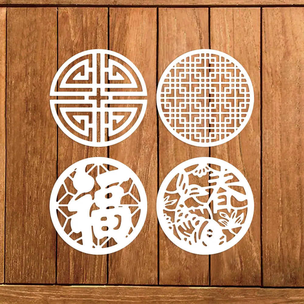 Four white circular metal cutting dies featuring intricate traditional Chinese designs with auspicious symbols for Chinese New Year decorations.