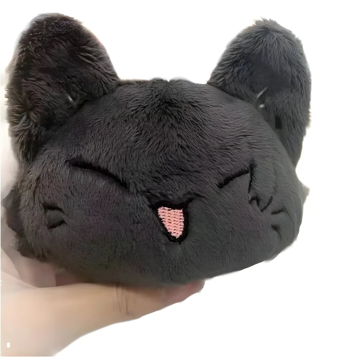 A soft black plush Gojo and Geto cat anime keychain with closed eyes and a pink embroidered tongue.