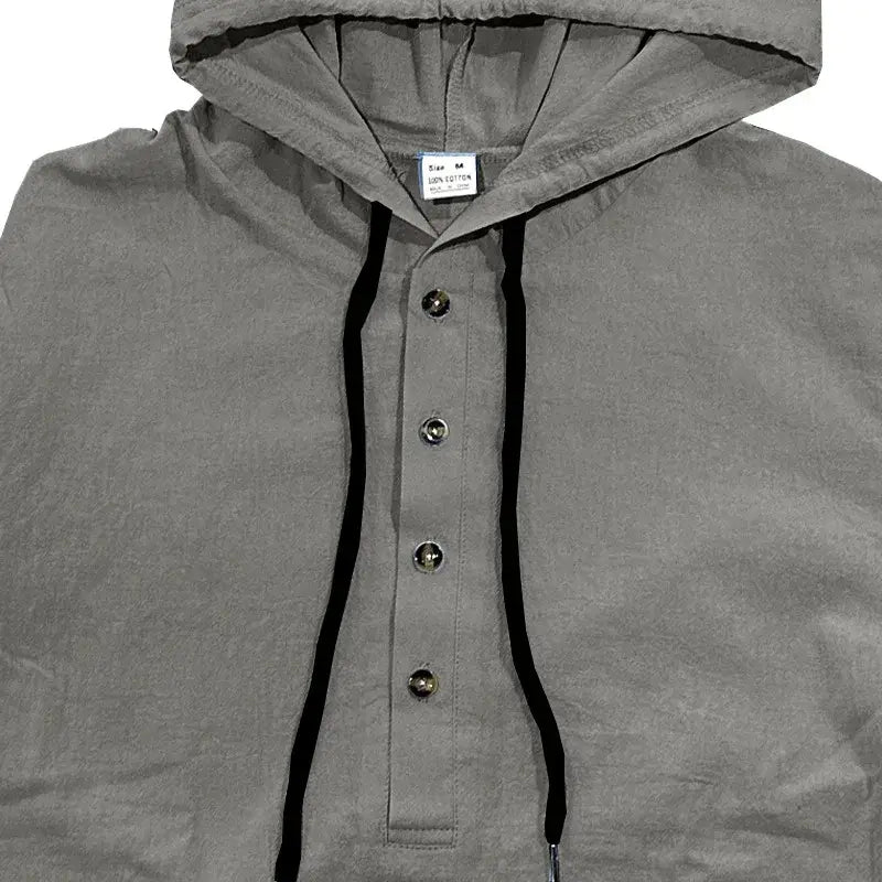 Men cotton linen hooded henley shirt in gray with black drawstrings and silver buttons down the front.