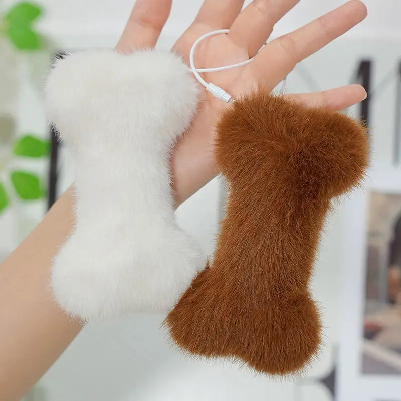 two kawaii bone shape plush phone charms in white and brown with faux-fur material and attached usb cables for charging featured as a bone shape plush pillow soft nap cushion accessory