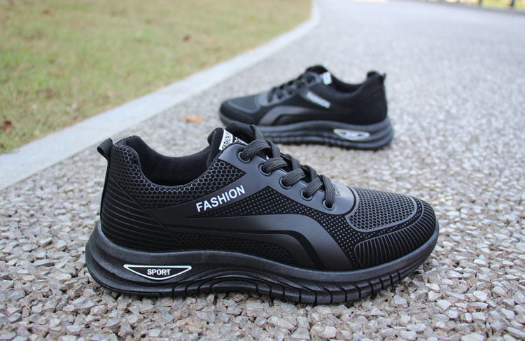 Men breathable athletic sneakers running shoes in black mesh and synthetic leather with fashion branding and a textured rubber sole.