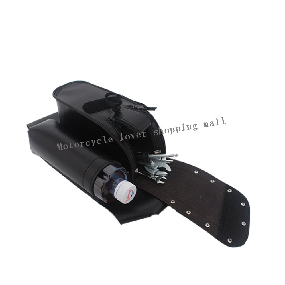 Black leather Harley touring saddlebag guard bag with a zippered main compartment, reinforced stitching, and silver rivets along the edges.