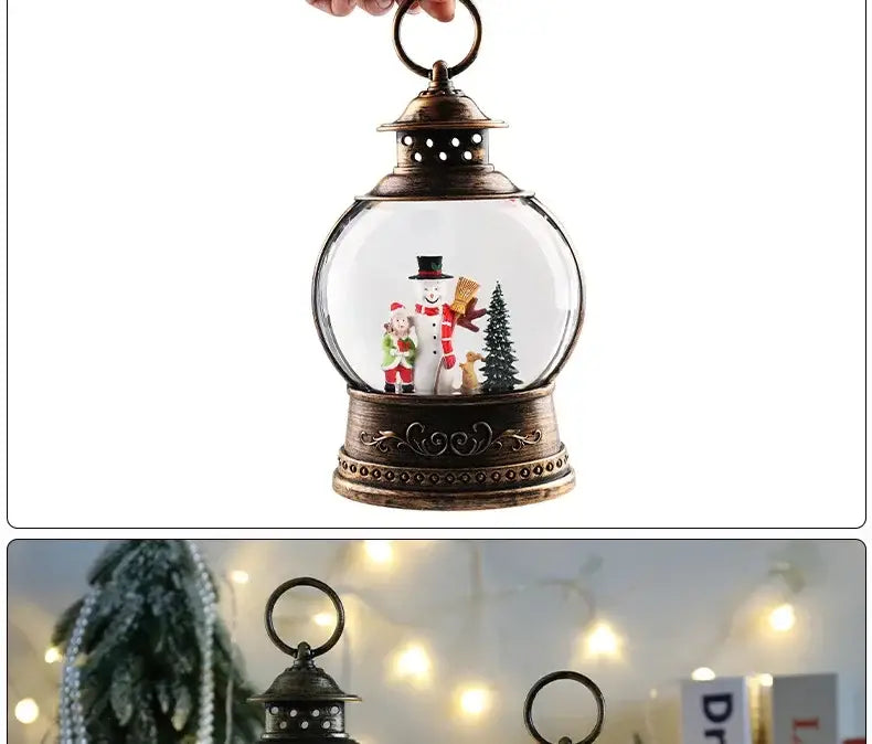 Antique brass lantern-shaped Christmas lantern snow globe music box featuring a clear glass sphere with miniature Christmas figures including a snowman Santa Claus and a pine tree.