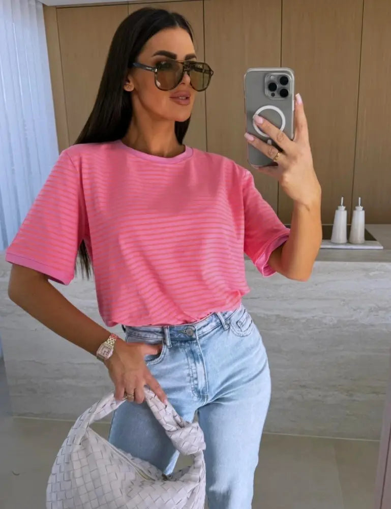 pink striped short sleeve t shirt made of lightweight fabric designed for casual summer wear