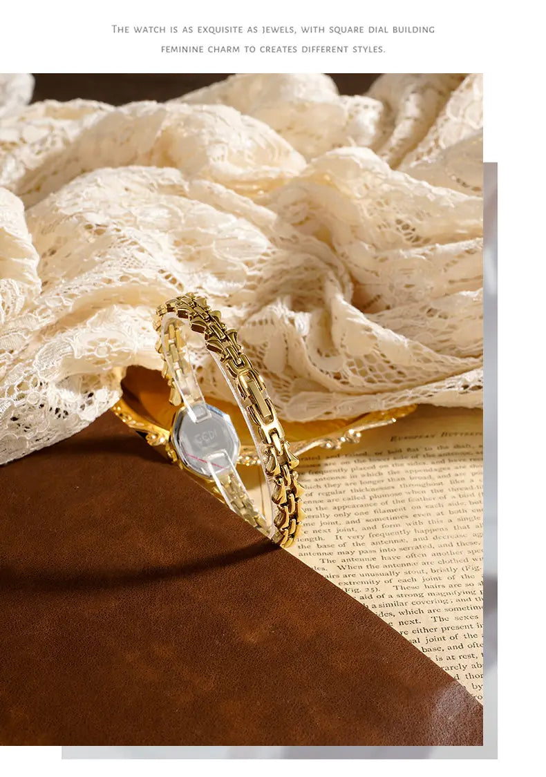 Gold octagonal quartz watch with a gold-toned chain-link bracelet and a square dial featuring a transparent face for ladies luxury wear.