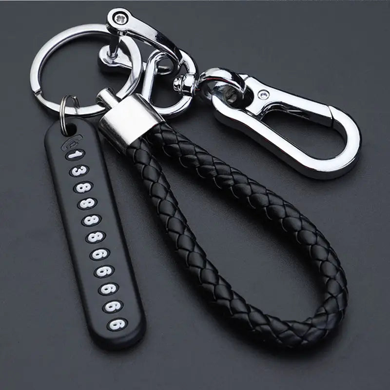 Black braided leather anti-lost car key ring pendant with silver-toned stainless steel clasp and car number plate charm.