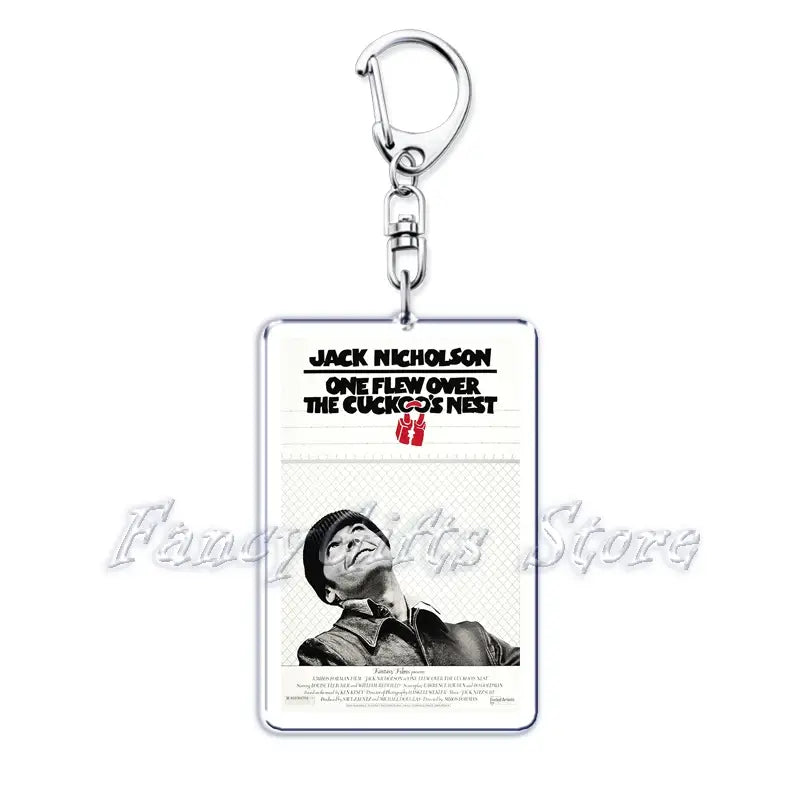 Silver rectangular acrylic keychain featuring a black and white movie poster for one flew over the cuckoos nest with jack nicholson from the movie poster acrylic keychain set.