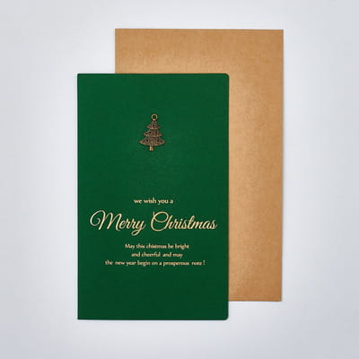 deep green christmas greeting card with gold foil lettering and a small golden tree emblem included in the christmas greeting cards set with gold foil envelopes