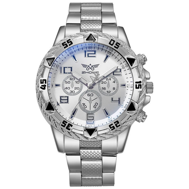 Montre à quartz à chronographe en acier inoxydable Tvk avec un boîtier argenté, un cadran blanc avec des marqueurs horaires triangulaires noirs et des chiffres, un accent bleu sur la lunette externe, et un bracelet en acier inoxydable texturé.