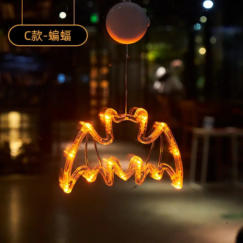 orange led light-up bat-shaped window decoration with a spherical top for halloween battery operated pumpkin ghost decor