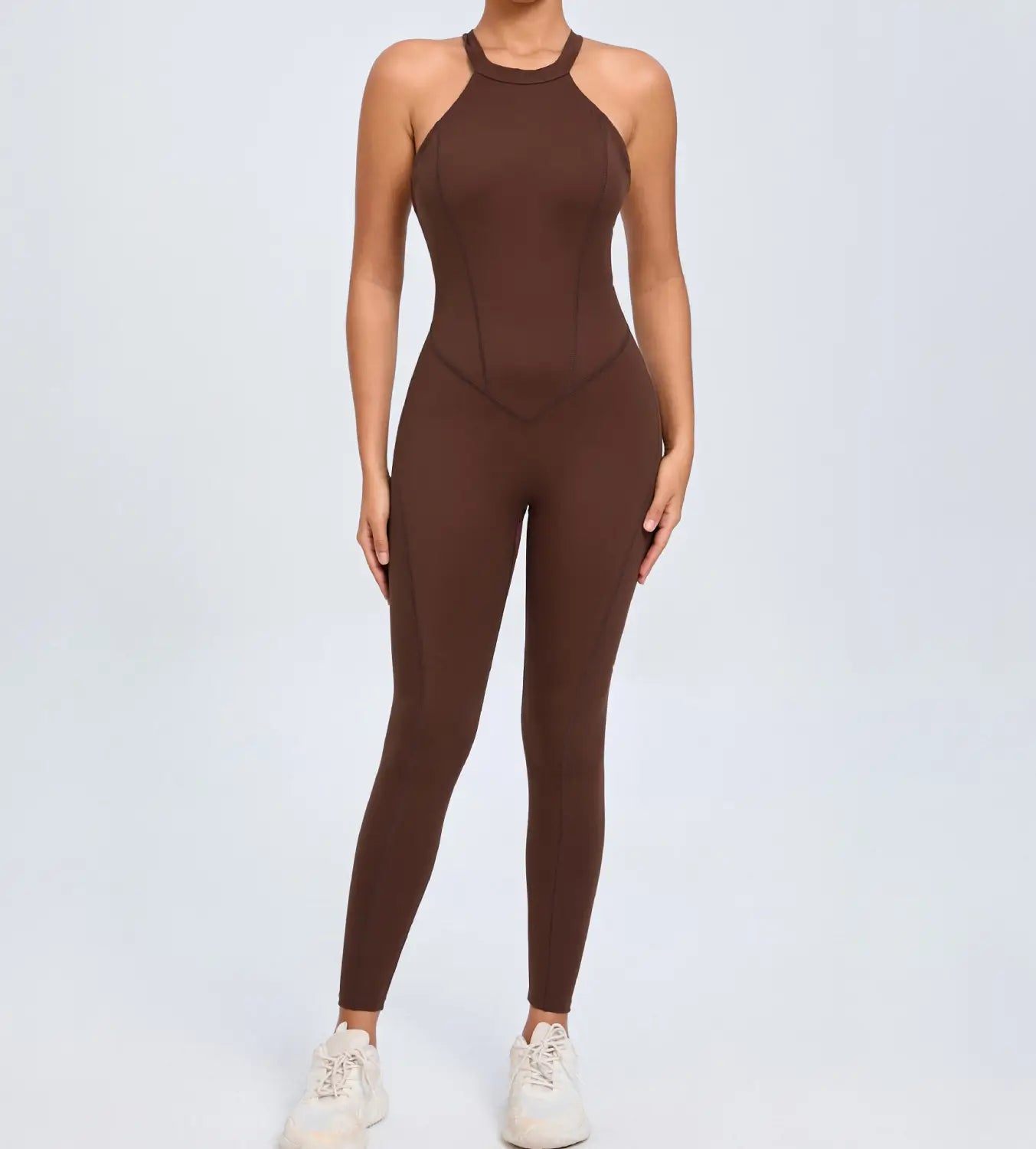 A sleek solid brown high necked one piece athletic jumpsuit made of stretchy fabric shown from the back for workout use.
