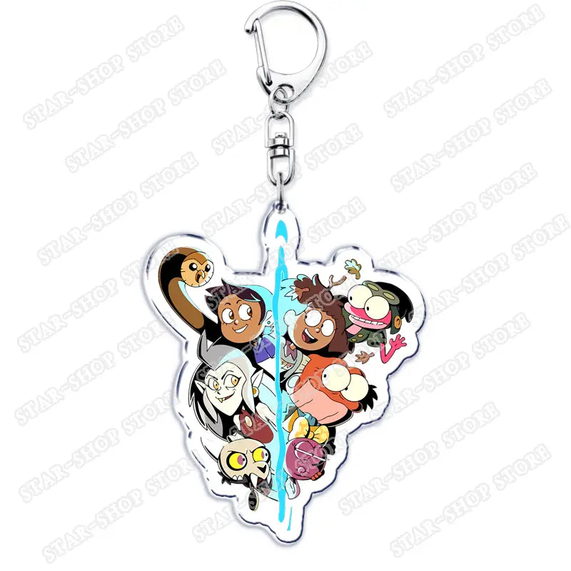Clear acrylic Amphibia anime keychain featuring animated characters from The Owl House arranged in a heart-shaped design with a silver metal clasp.