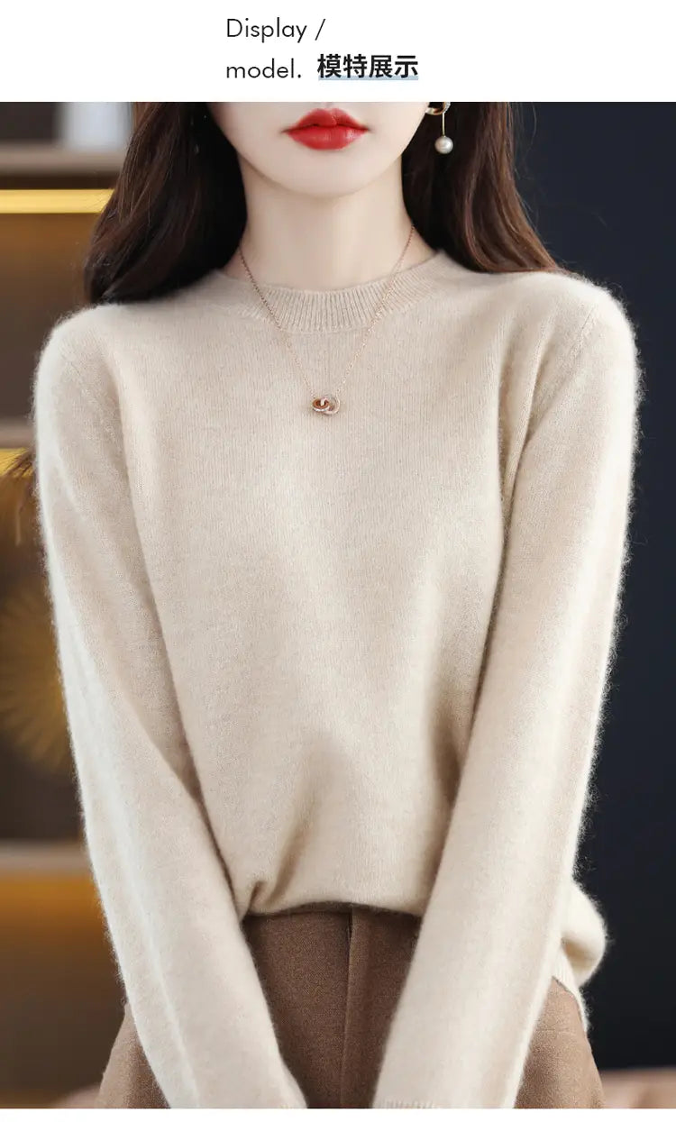 Cream-colored long-sleeved pure wool cashmere pullover sweater with a soft fluffy texture and round neckline.