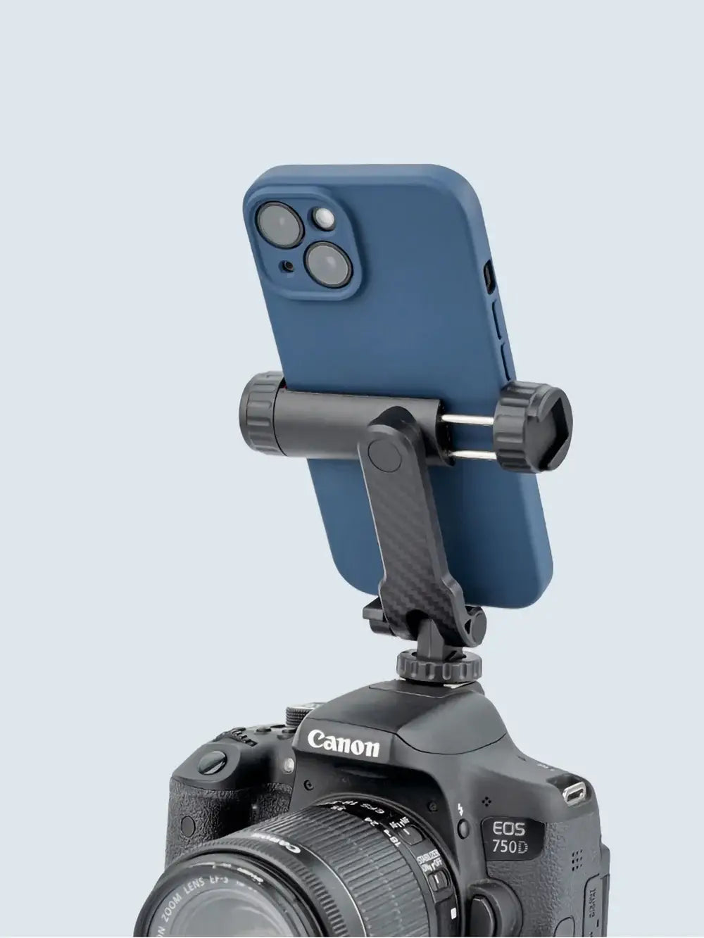 blue smartphone mounted on a black phone tripod mount 360 rotating dual cold shoe adapter for stable photography.