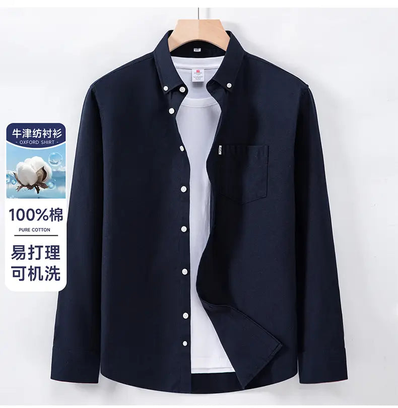 Navy blue men cotton oxford long sleeve casual shirt with white buttons and a chest pocket.