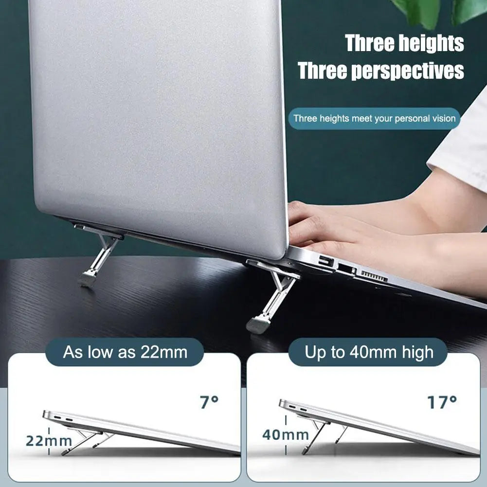 Support portable pliant pour ordinateur portable en aluminium argent métallique, avec réglages de hauteur et d’angle pour une utilisation ergonomique.