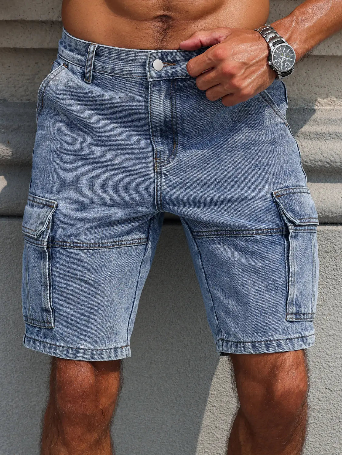 Men blue denim cargo shorts in light wash featuring multiple pockets and a casual relaxed regular fit.