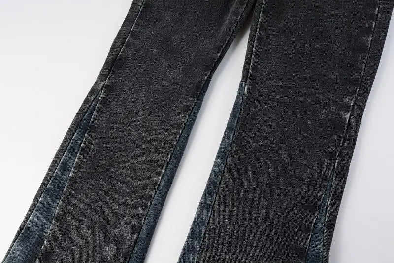 Men flare jeans in distressed dark gray denim with a dark-wash slightly faded and textured look along the seams.