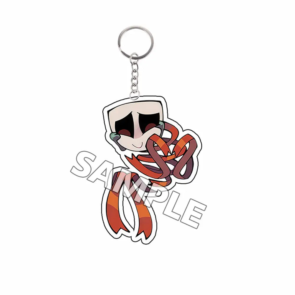 Producto terminado de llavero acrílico con un personaje caricaturesco con bufanda a rayas naranja y rojo, envuelto, en acrílico traslúcido, con aro metálico plateado.