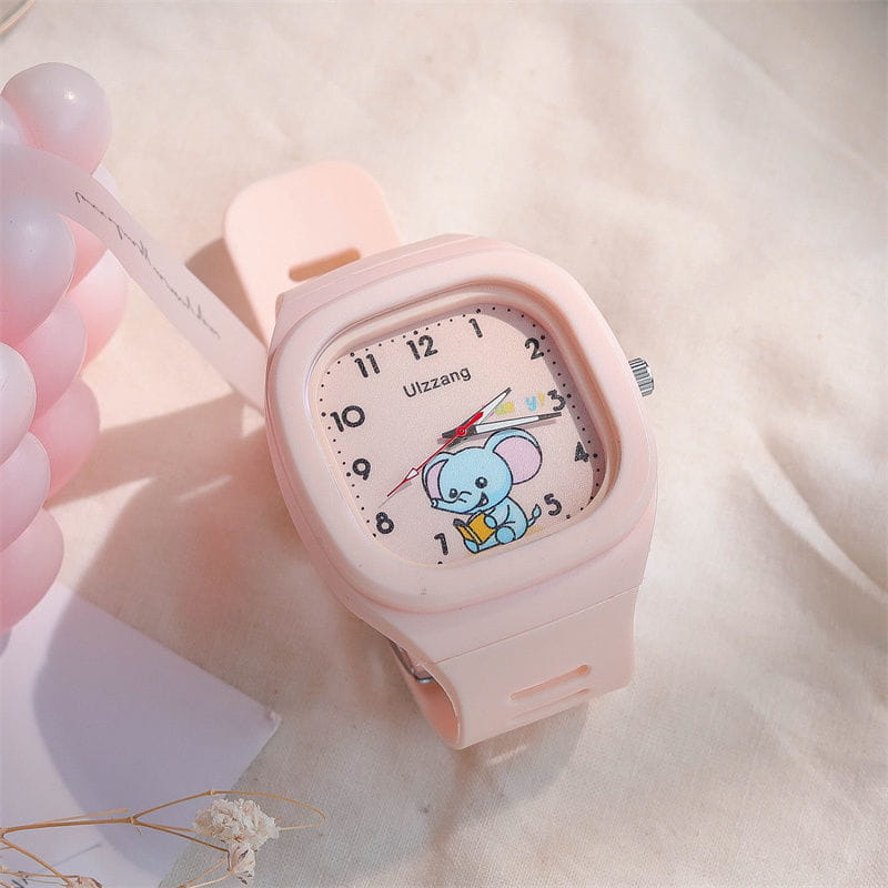 Kids luminous cartoon elephant digital watch with a pink silicone band and a square face featuring a blue elephant holding a book on the dial.