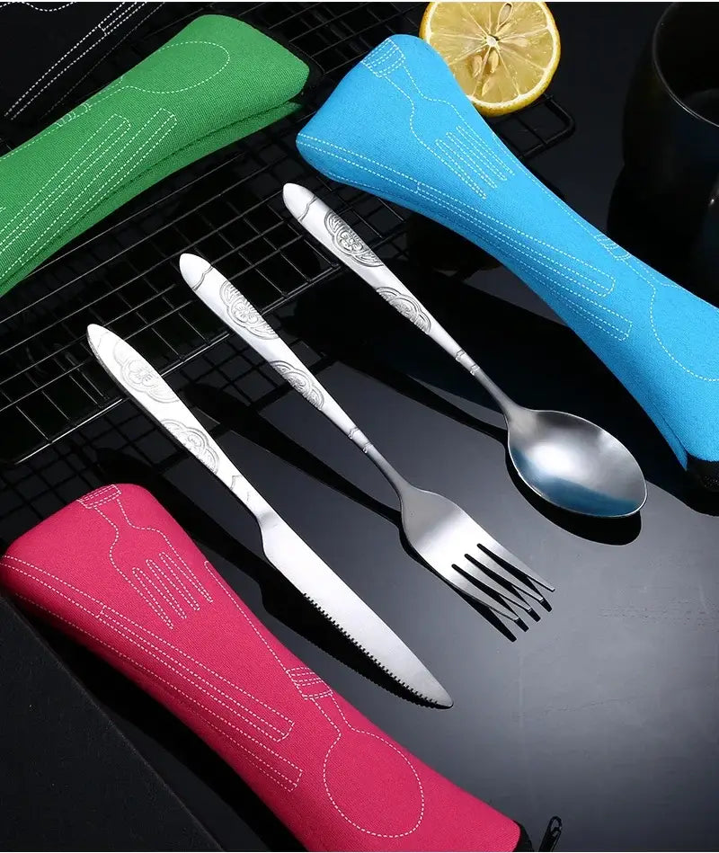 Set of stainless steel portable travel cutlery with engraved handles in colorful fabric cases.