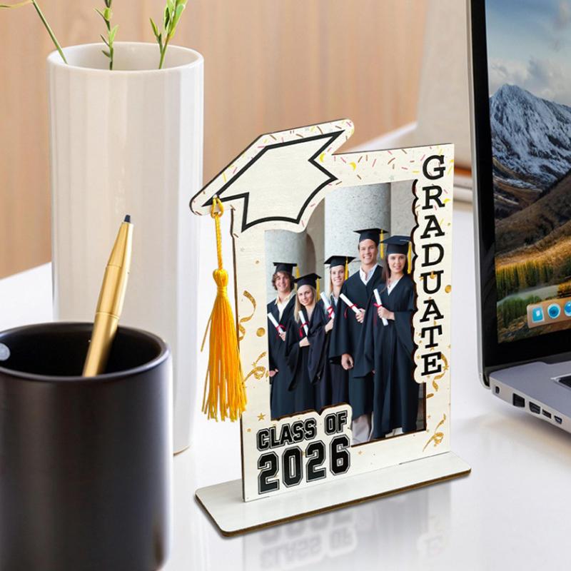 Class of 2026 wooden graduation photo frame in white featuring a decorative mortarboard with a gold tassel and black graduate and class of 2026 lettering.