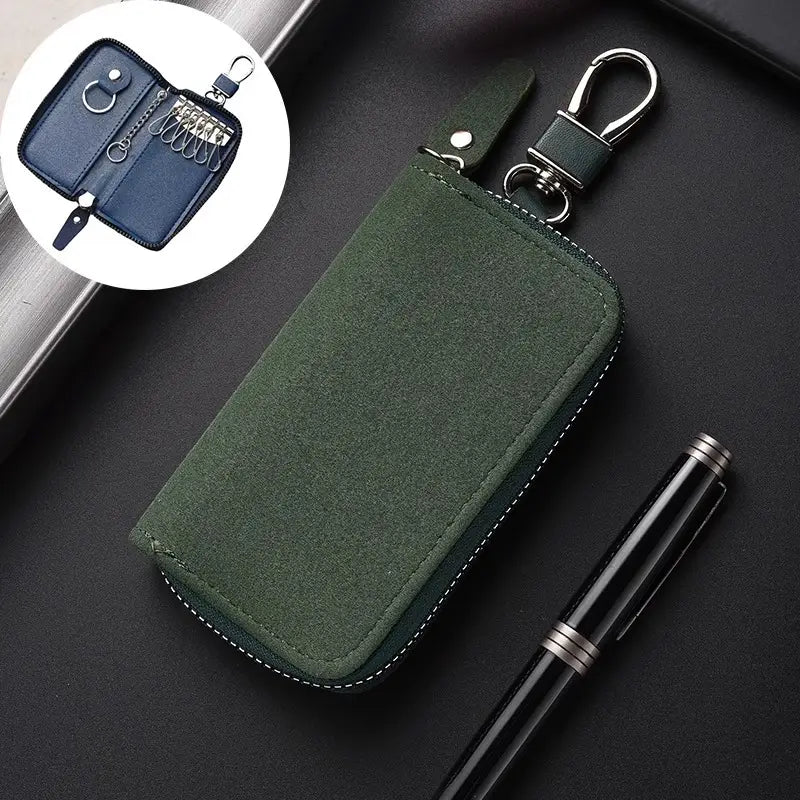 Dark green suede leather key holder organizer pouch with silver-toned zipper and metal carabiner clip.
