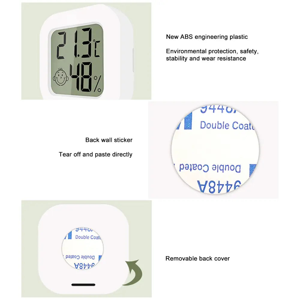 White rectangular digital thermometer and hygrometer room sensor with smiling face icon on the display showing the measurement range.
