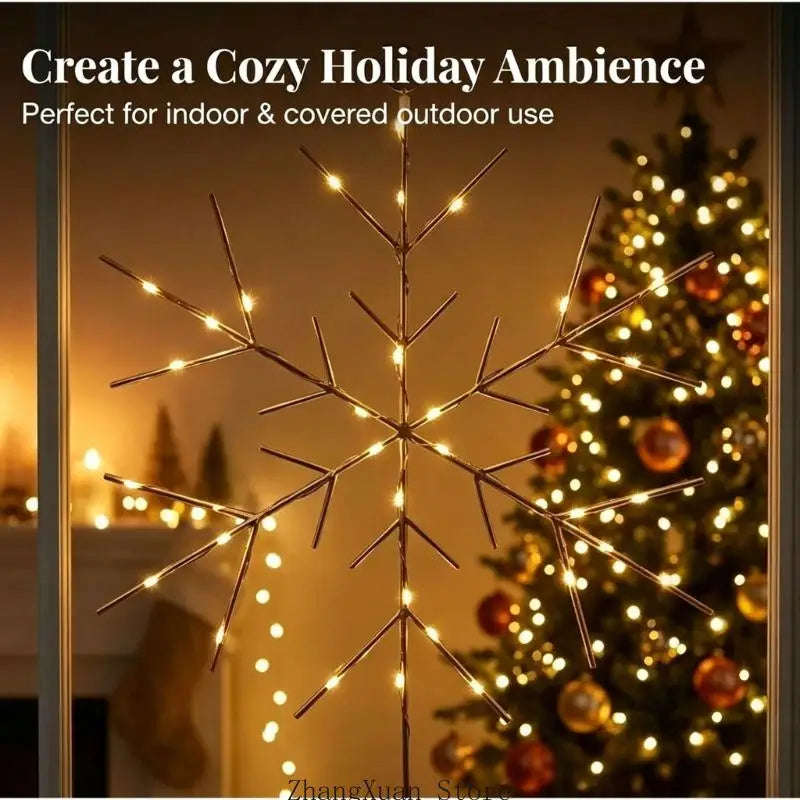 A glowing gold snowflake Christmas tree and wreath ornament made of metallic material with warm white LED bulbs arranged along its branches.