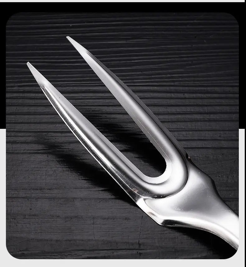 Shiny stainless steel two-pronged serving fork with a sleek modern design from a stainless steel kitchen utensil set 9-piece cooking tools.