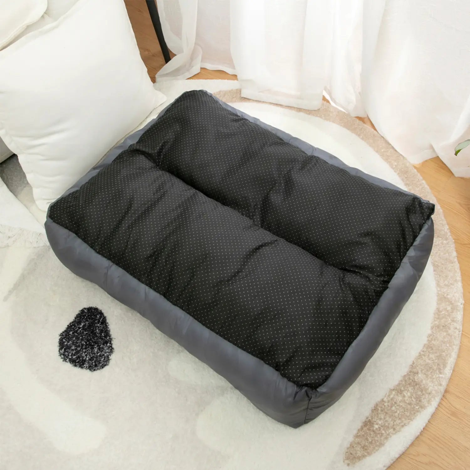 black and gray quilted dog bed with a dotted pattern designed as a plush dog sofa and puppy accessories for comfort and style