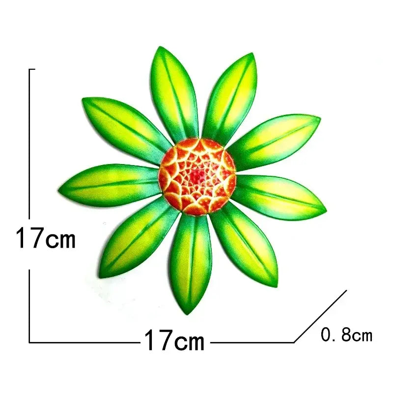 metal flower wall art sculpture featuring a vibrant green and orange painted metal flower with a 17cm diameter