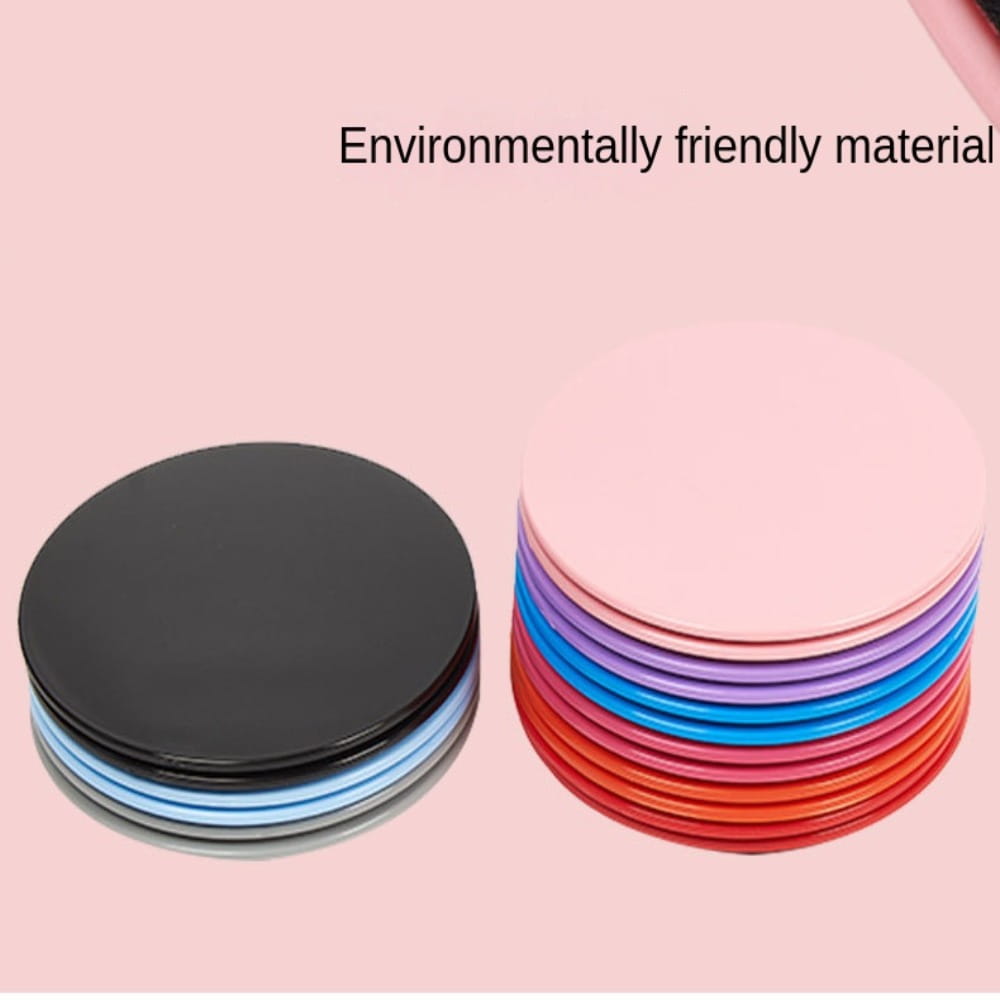 Stacks of colorful circular silicone Core Sliders fitness gliding discs in black and a vibrant rainbow gradient designed for abdominal training.