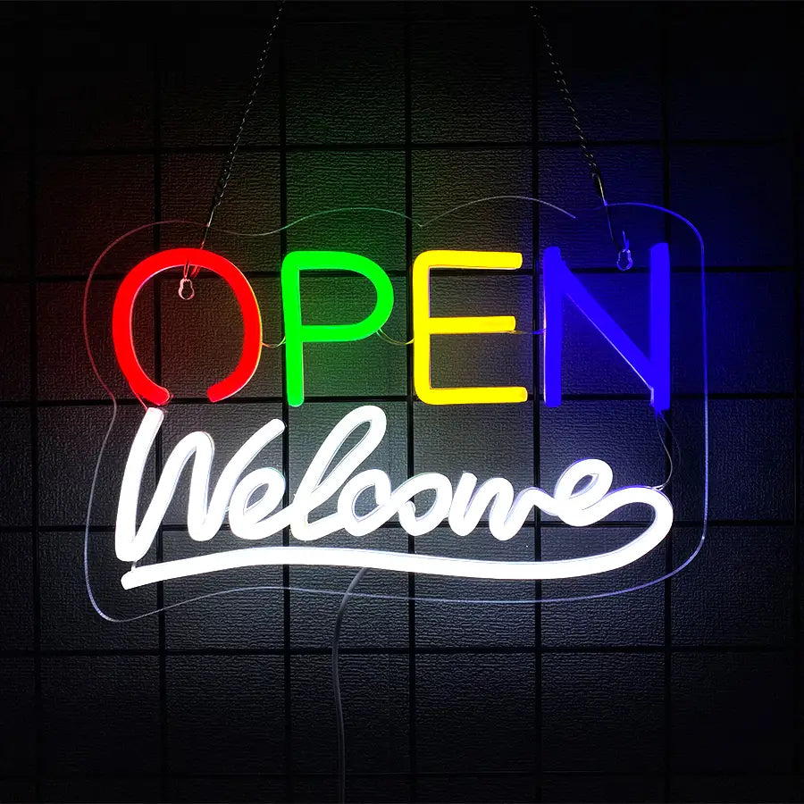 Enseigne néon vibrante de couleur arc-en-ciel, alimentée par USB, affichant « ouvert » en lettres rouges, vertes, jaunes et bleues, avec un accueil blanc en cursive en dessous.