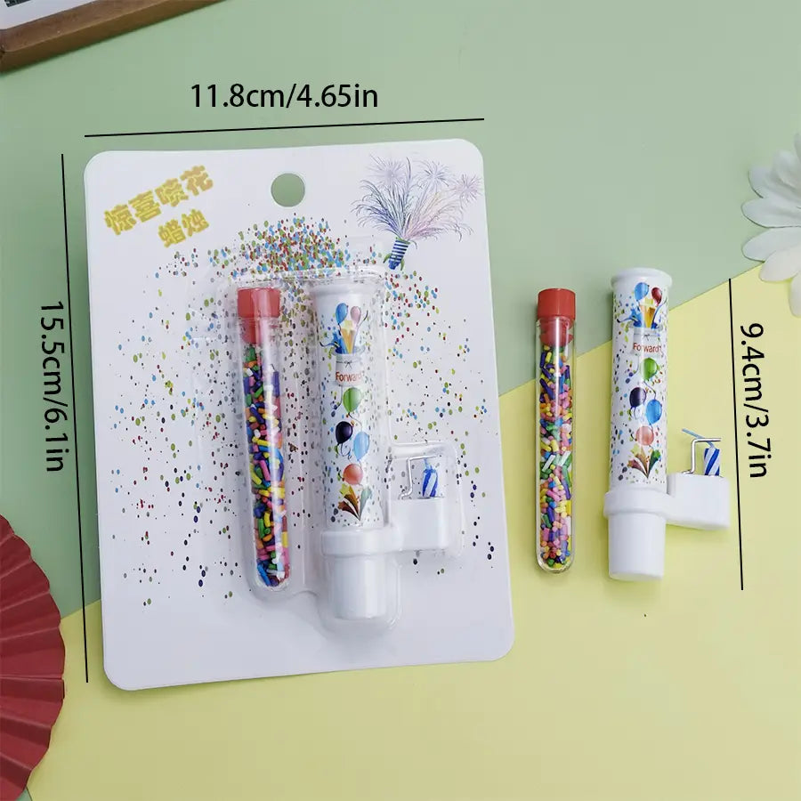 white plastic birthday cake pop-up confetti candle party popper with colorful balloon design and red cap packaged on a card